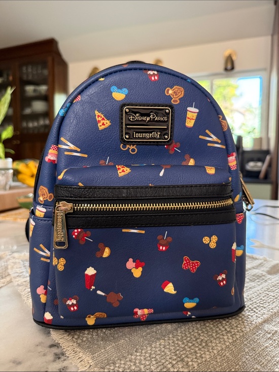 disney parks icons mini backpack by loungefly DLR - Icon the vibrant design is finished with multiple pockets and a double zip fastening. Loungefly Disney Parks Disneyland Ride